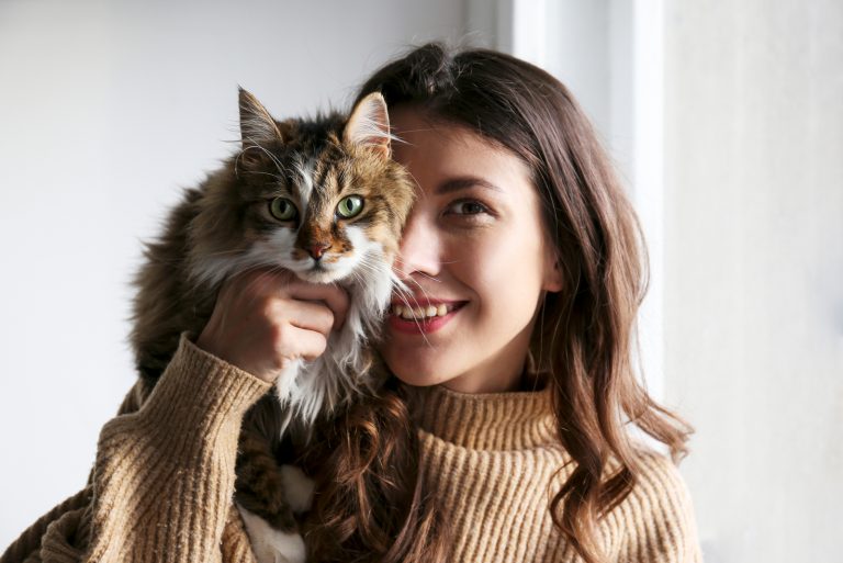 woman holding a cat