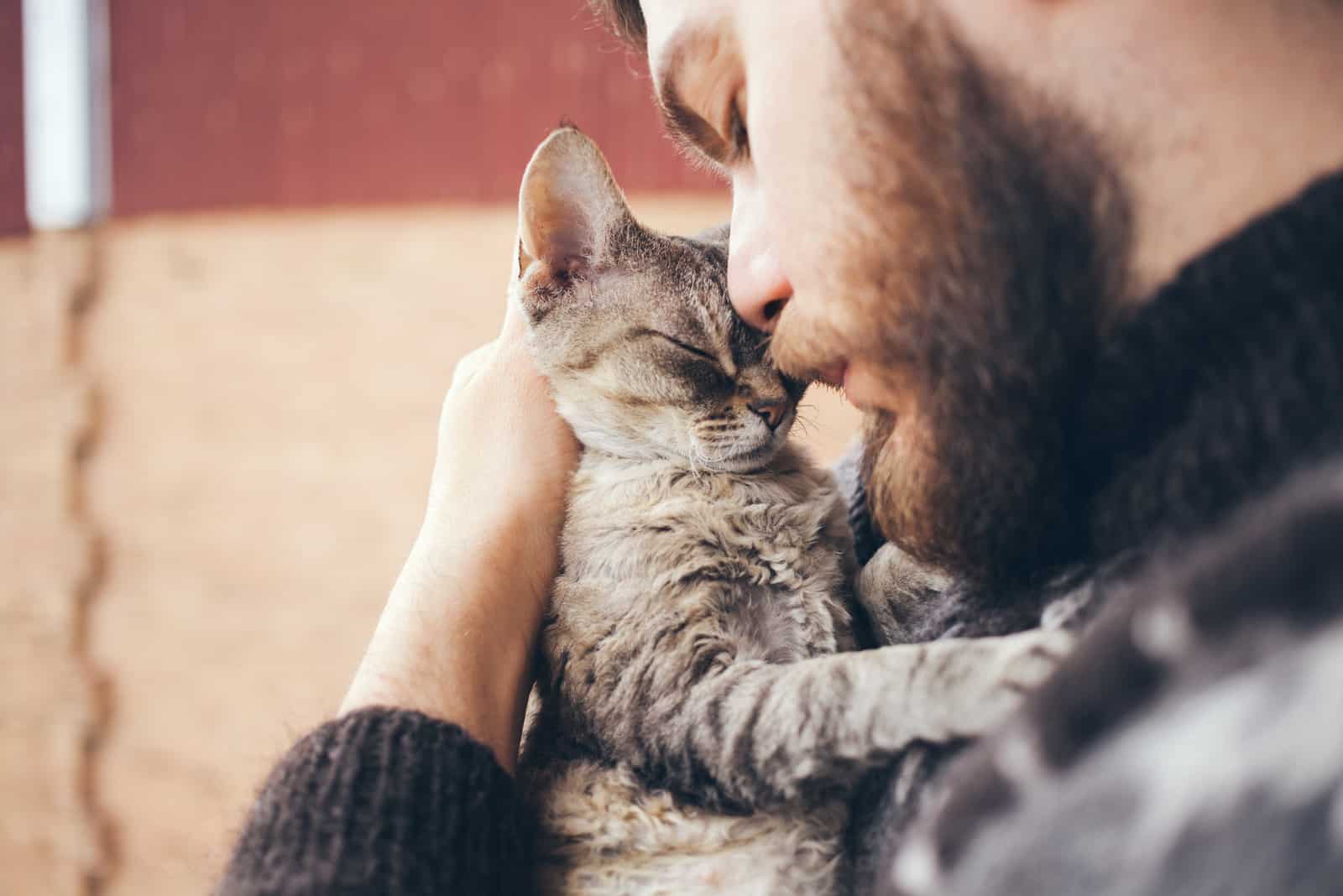 Handsome Young Man Cuddling his Gray Cat