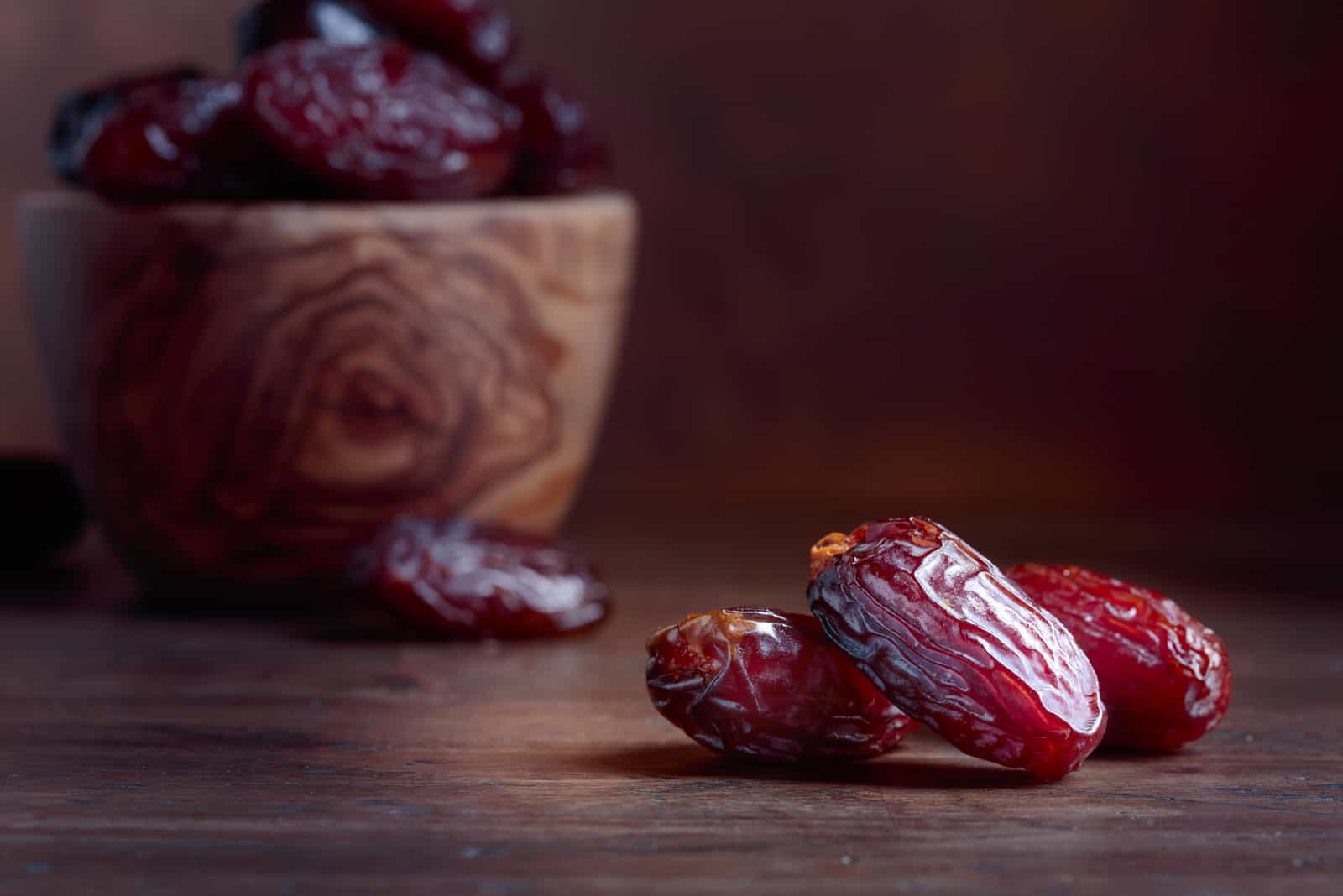 Juicy dates on a old wooden table