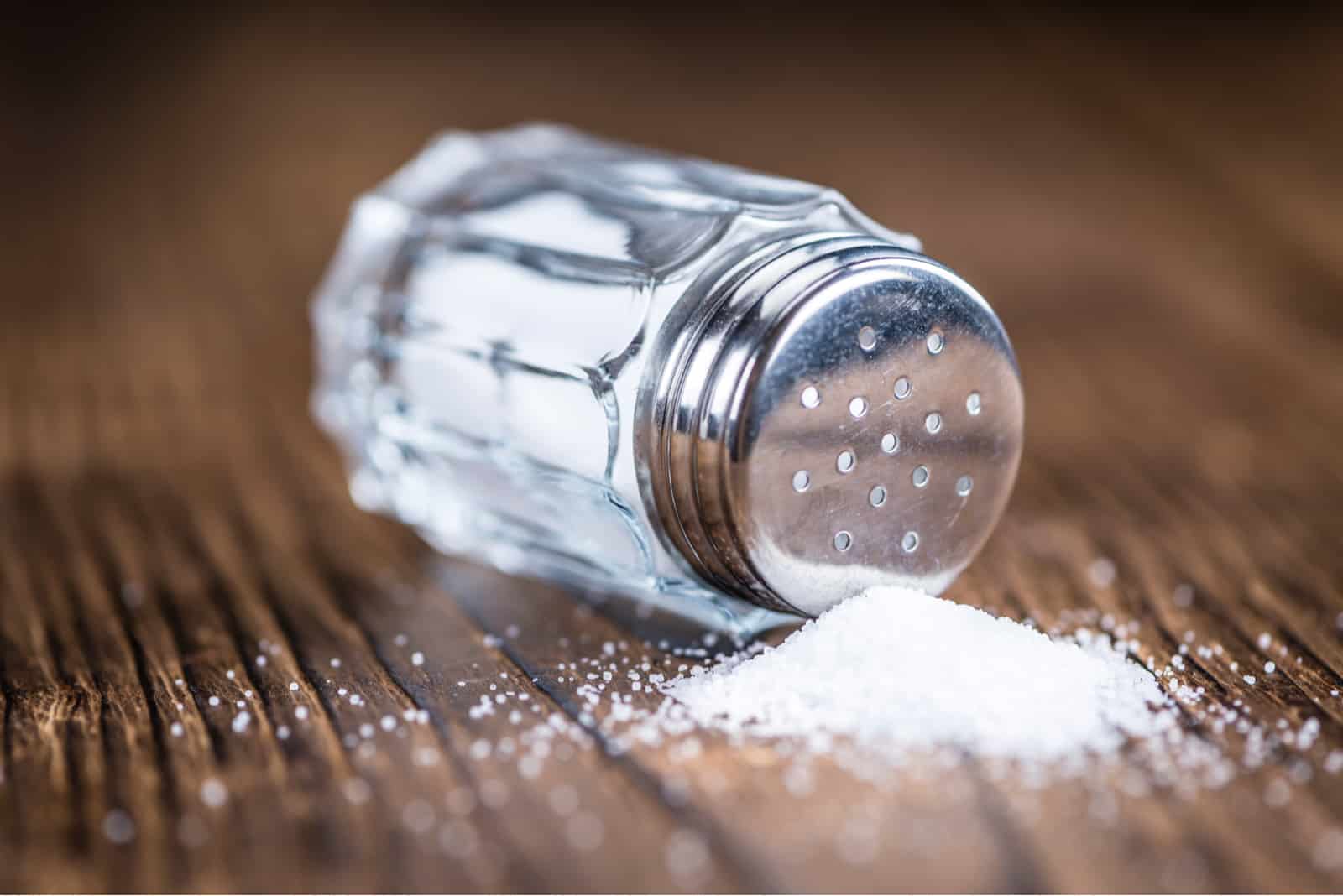 Old wooden table with a Salt Shaker 