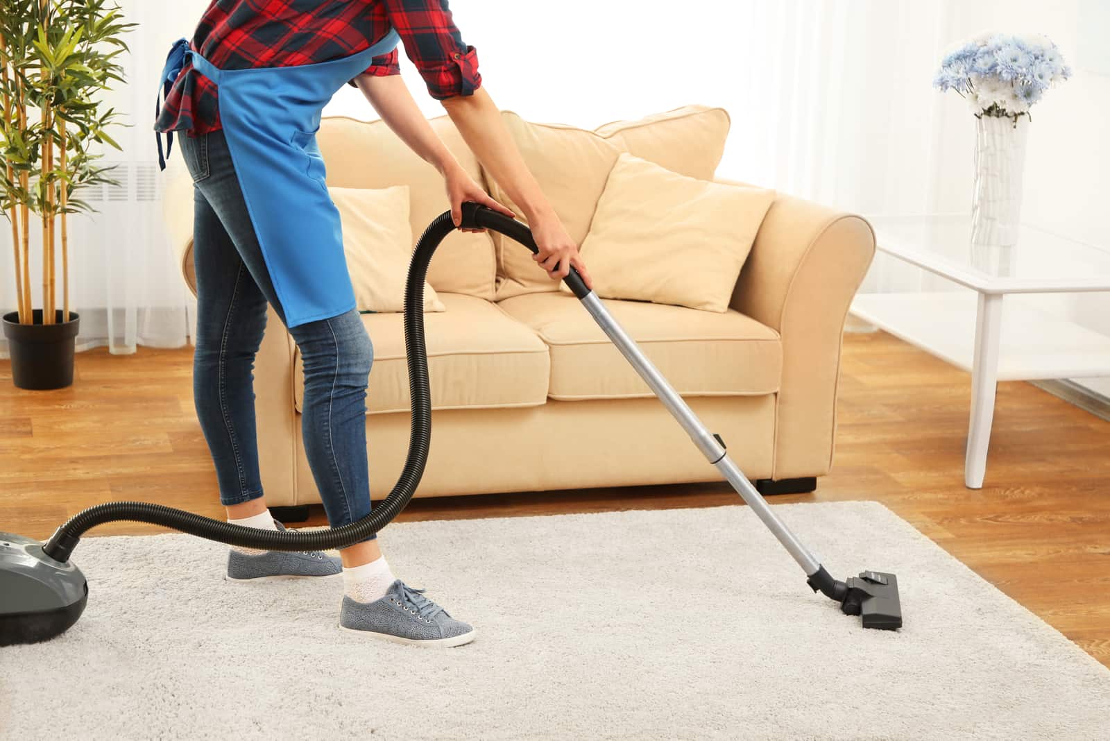 a woman vacuuming a house