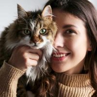 woman holding a cat