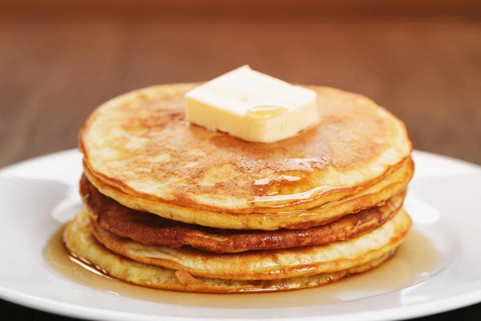 homemade pancakes with butter and maple syrup