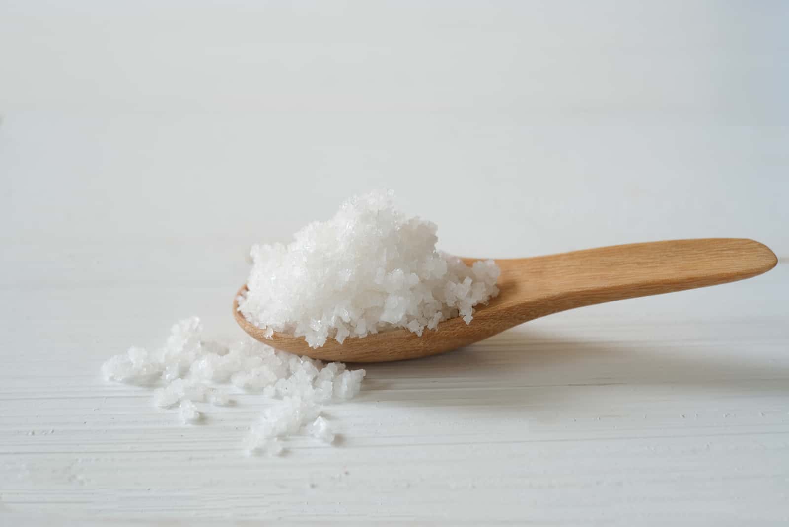 seawater salt in a wooden spoon