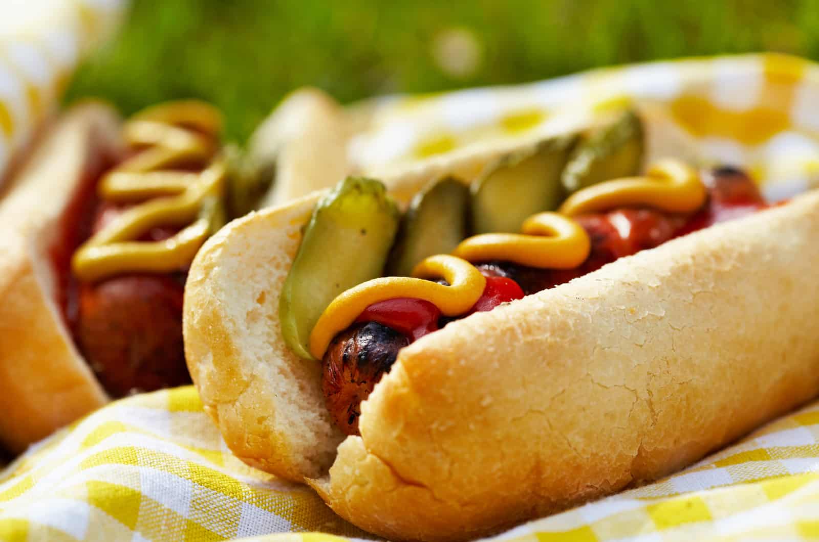 Grilled hot dogs with mustard, ketchup and relish