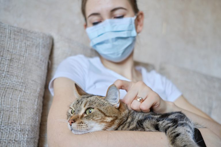 a sick woman with a cat in her lap