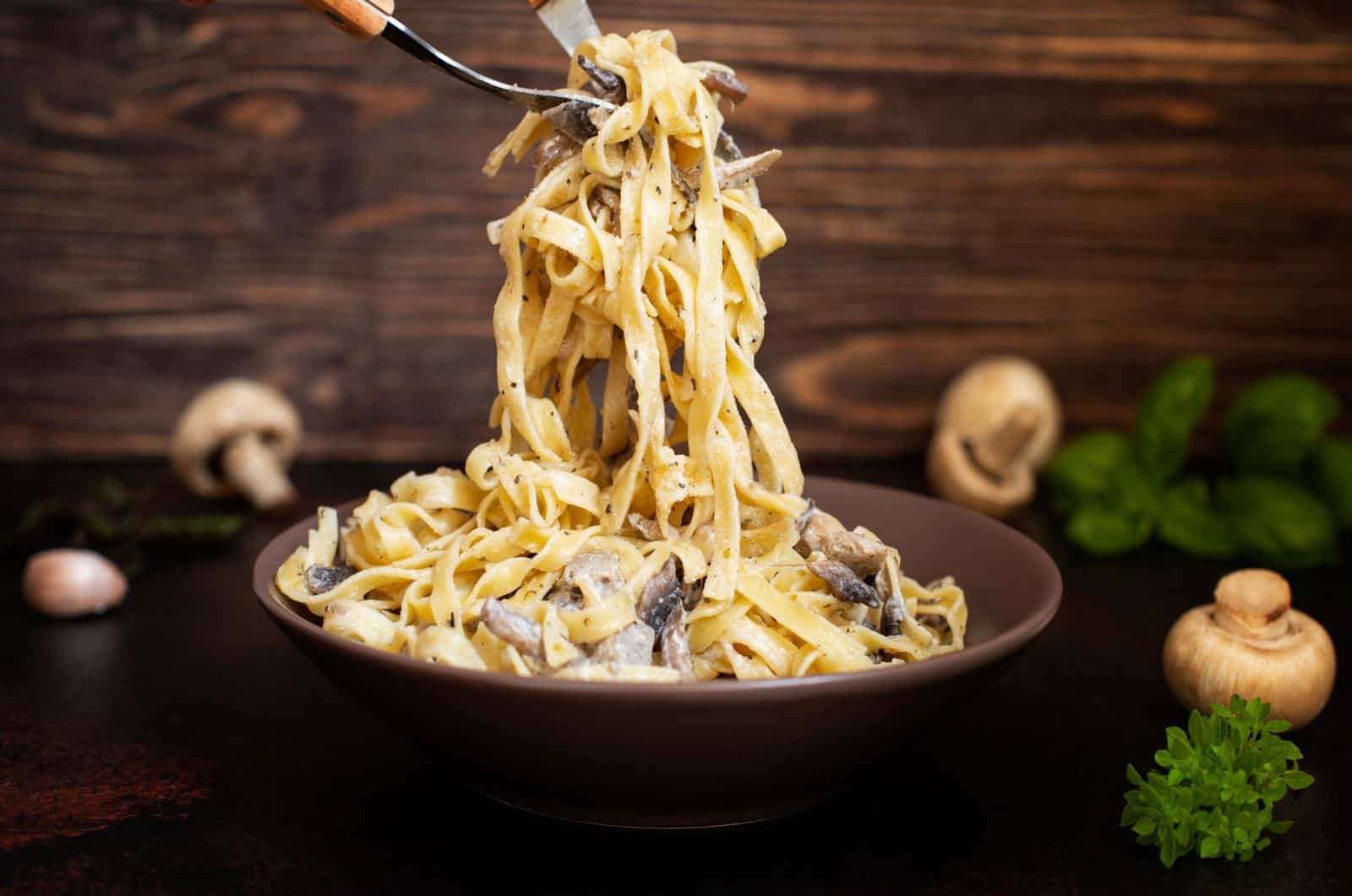 Homemade Italian fettuccine pasta with mushrooms and cream sauce