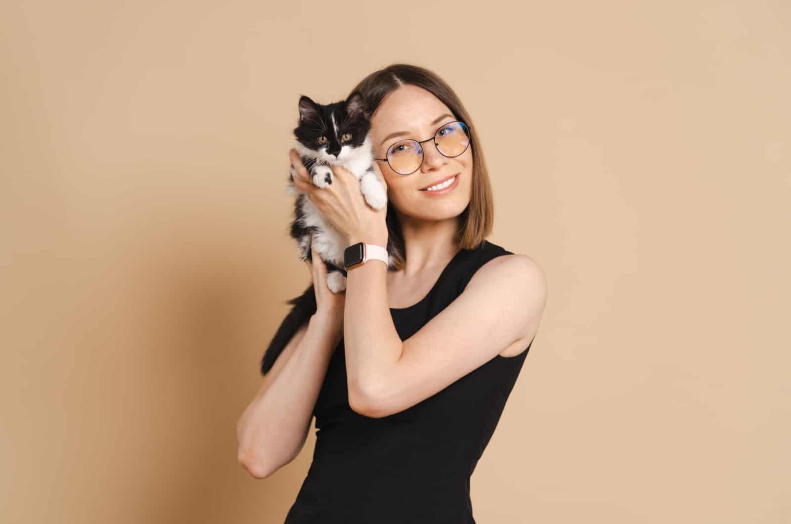 woman holding a kitten