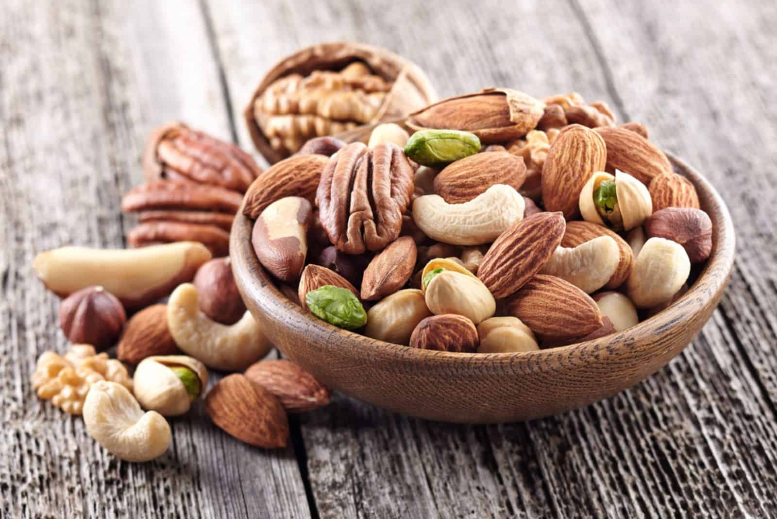 Nuts mix in a wooden plate