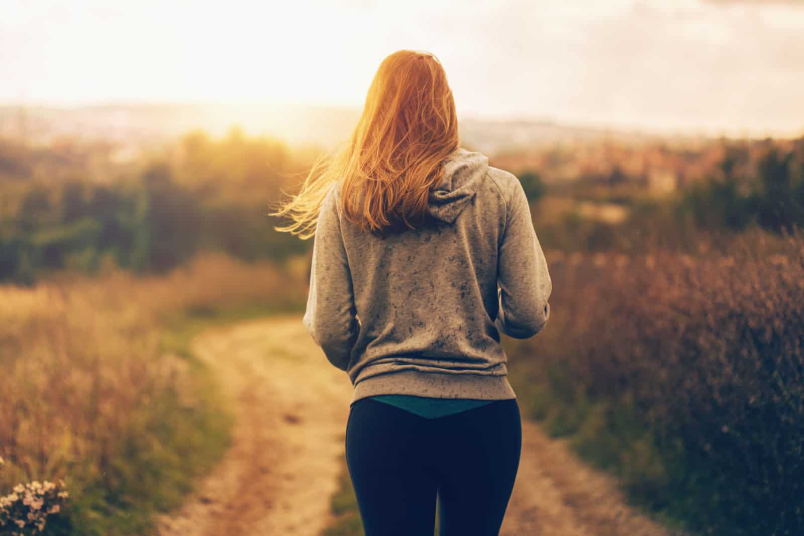 Woman walking a path down the hill