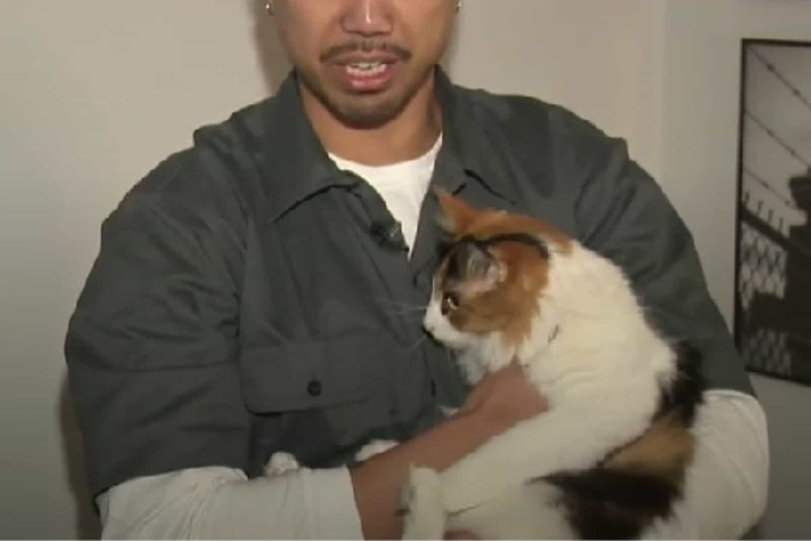 man holding a cat