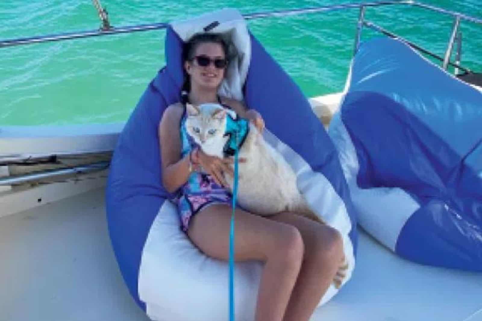 woman with cat on the boat