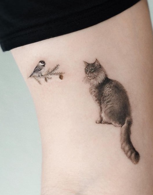 cat and bird tattoo