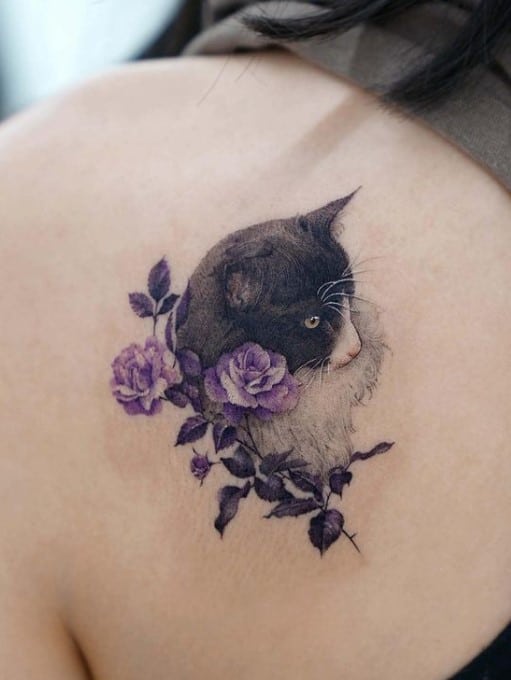 cat tattoo with purple flowers