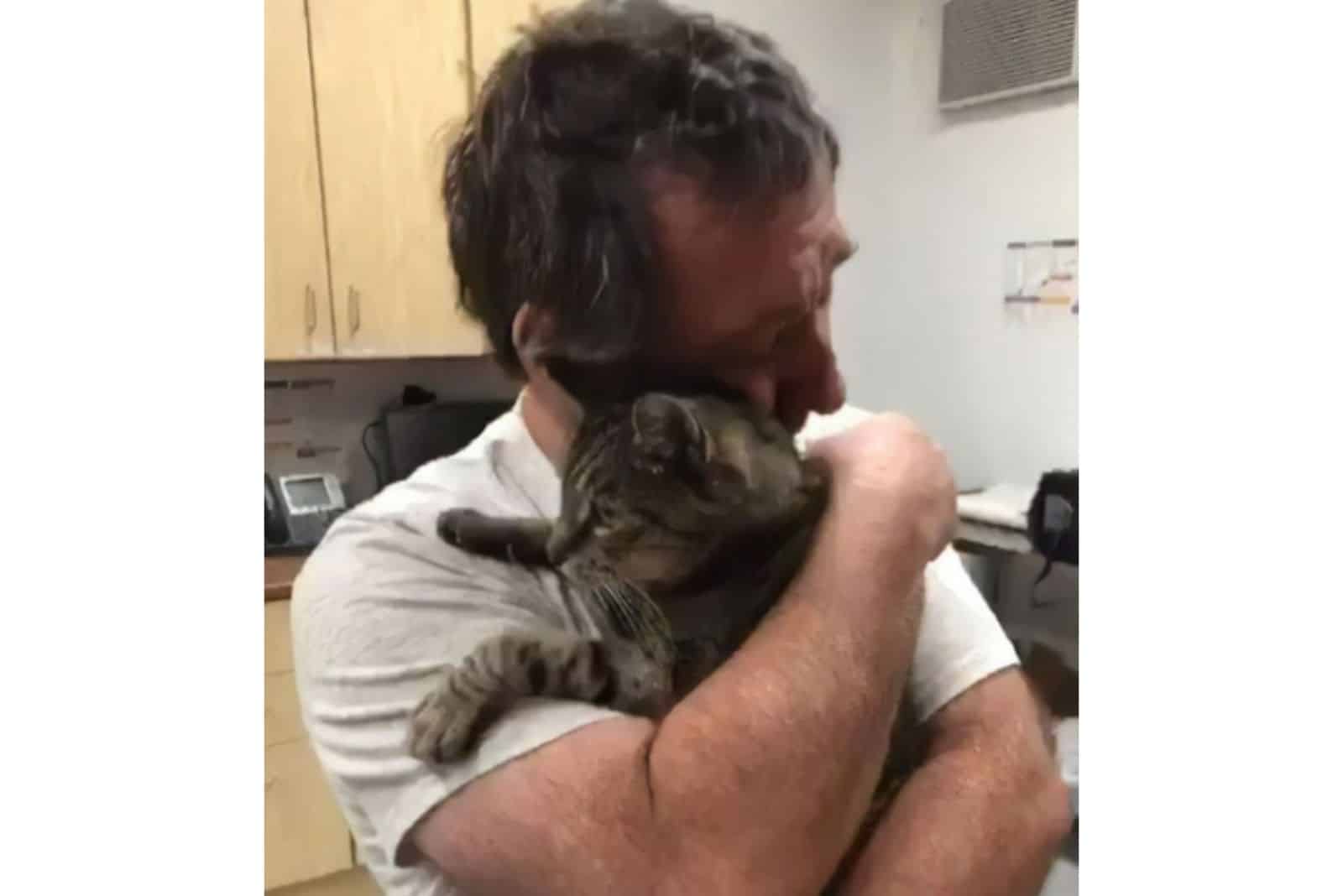 emotional man hugging cat