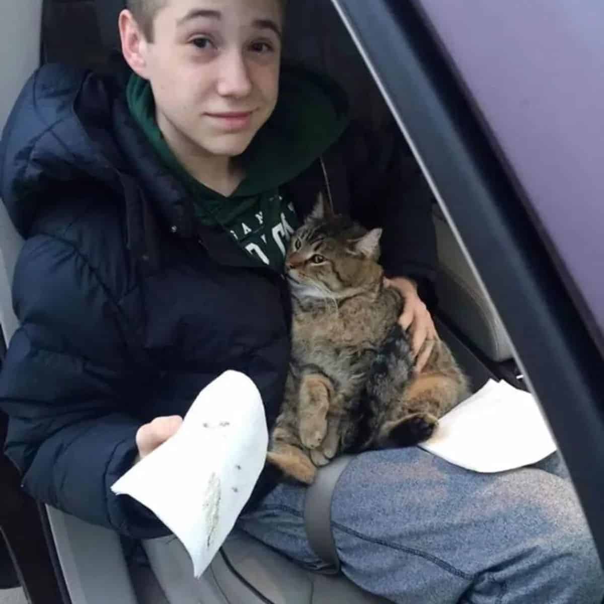 young boy with cat