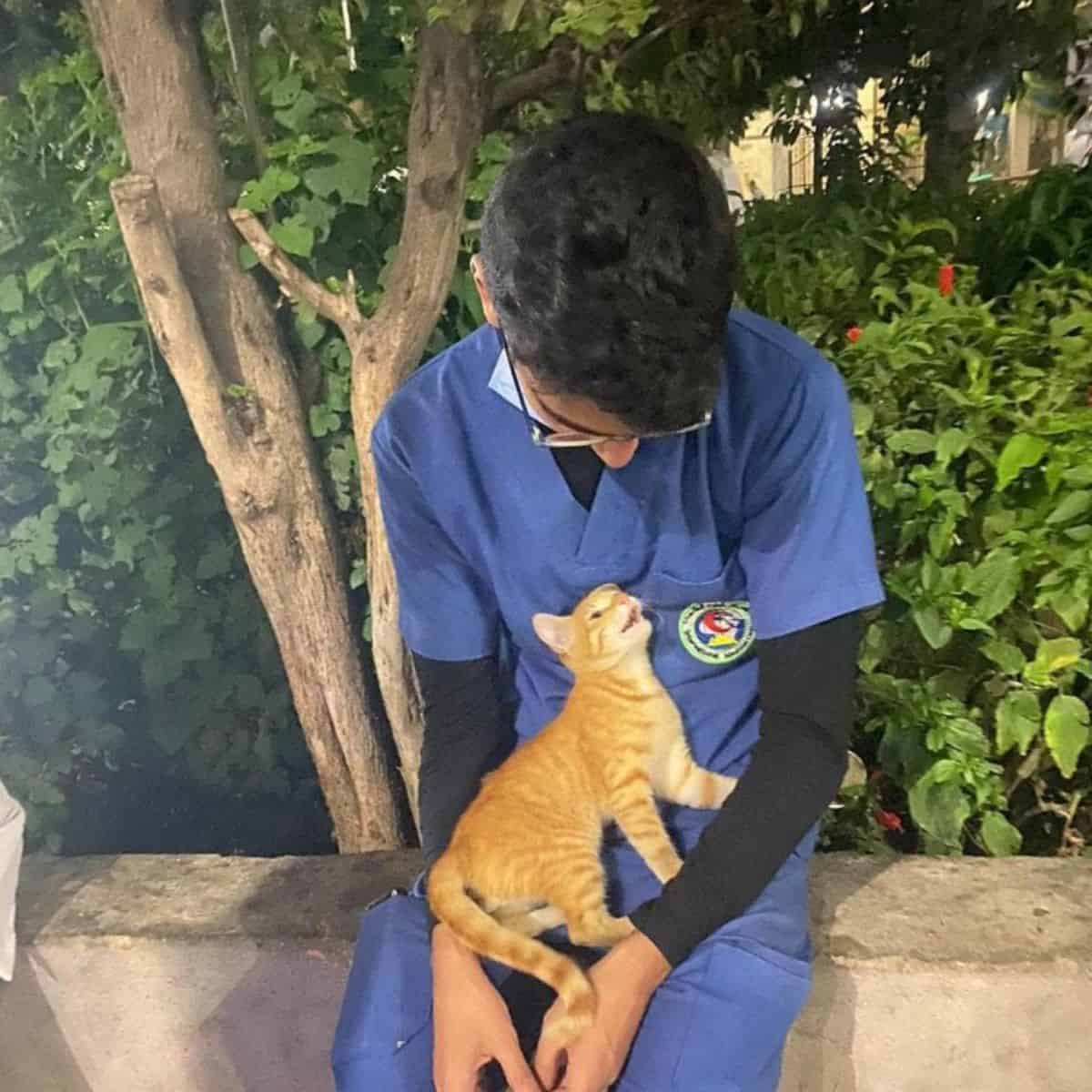 Guy holding a cat