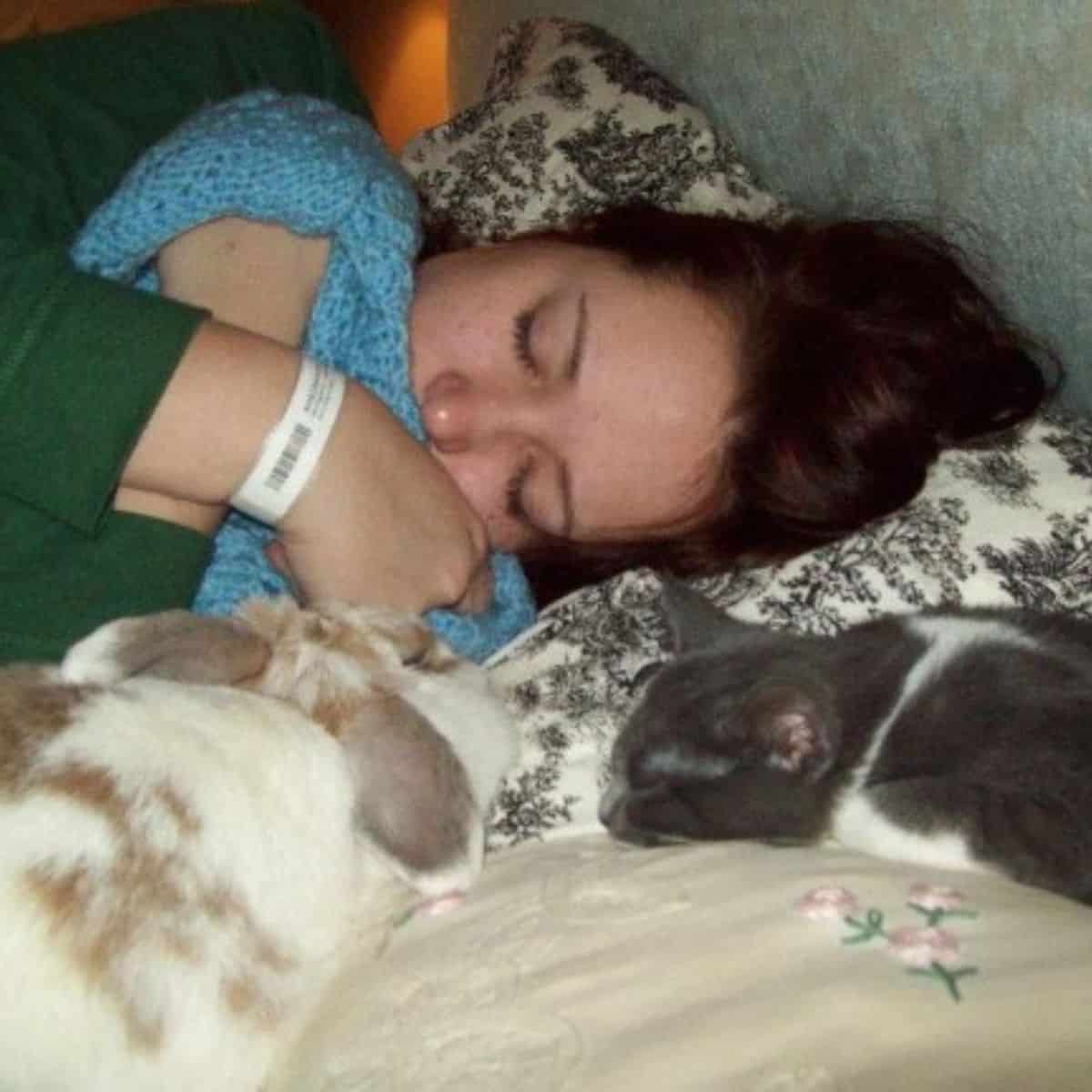 woman and cats sleeping