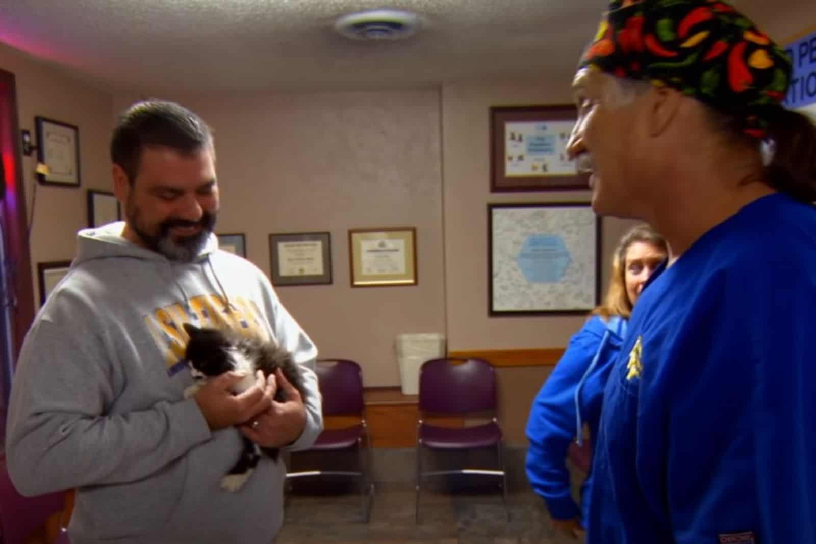 a man took a kitten from a veterinary station