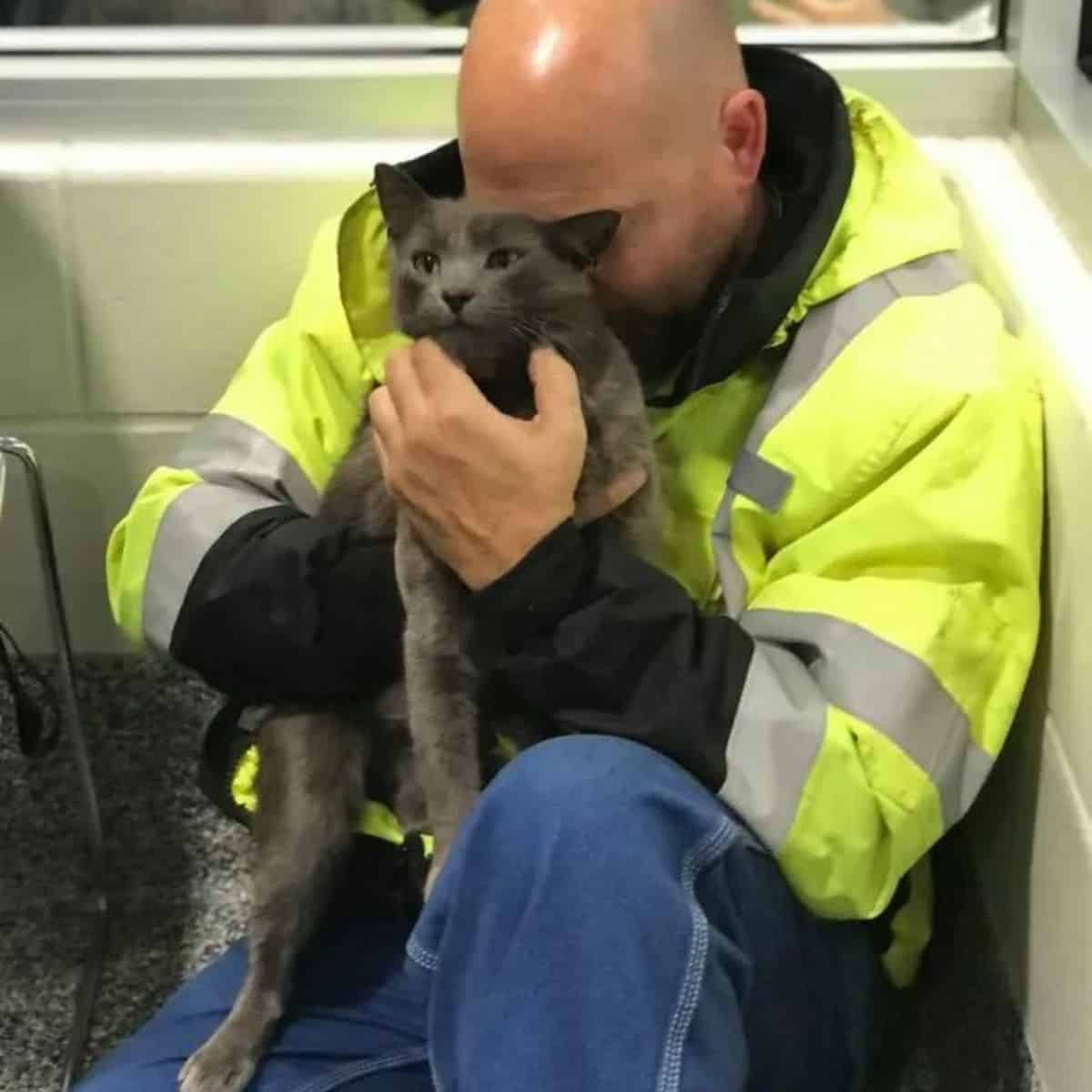 the driver hugs his cat after finding it