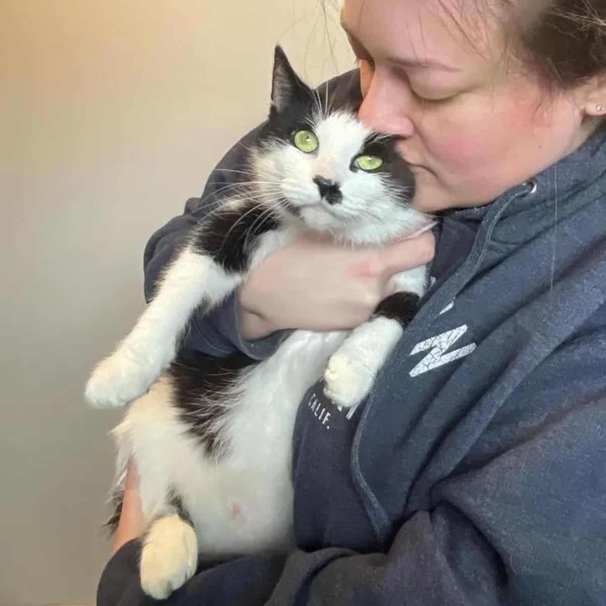 woman holding cat oreo