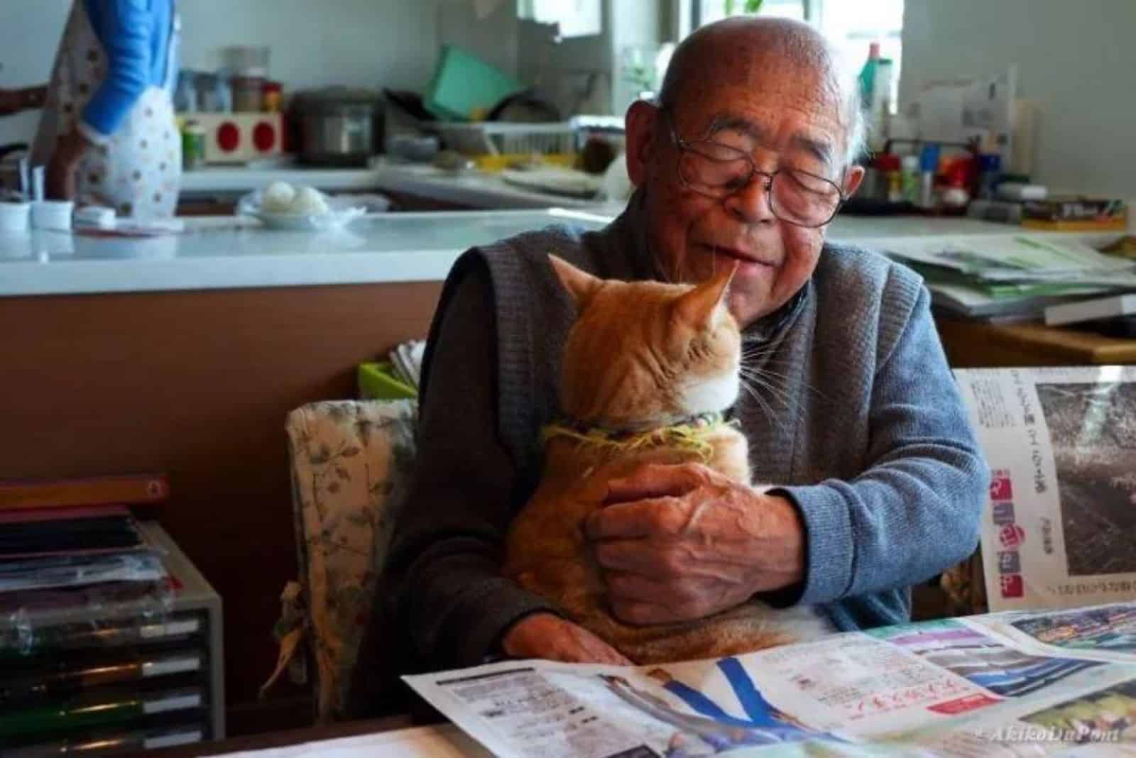 an old man with cat