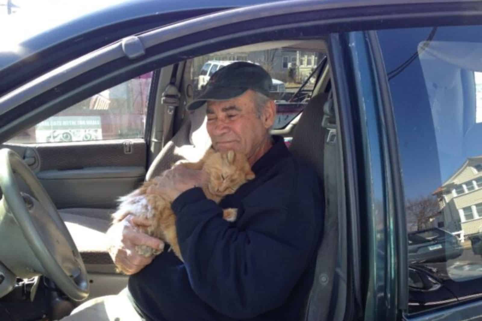 old guy holding his cat