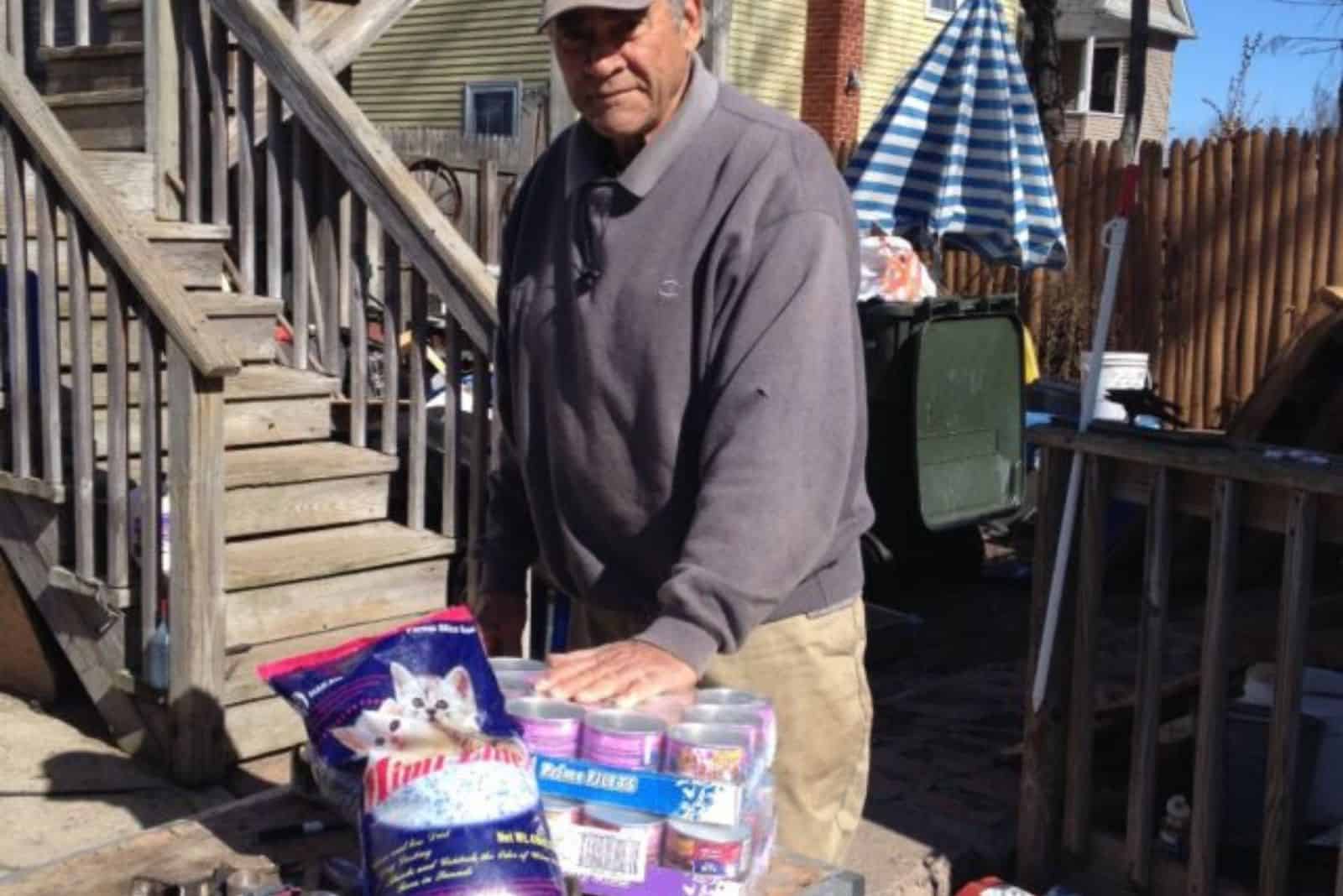 old guy with cat food