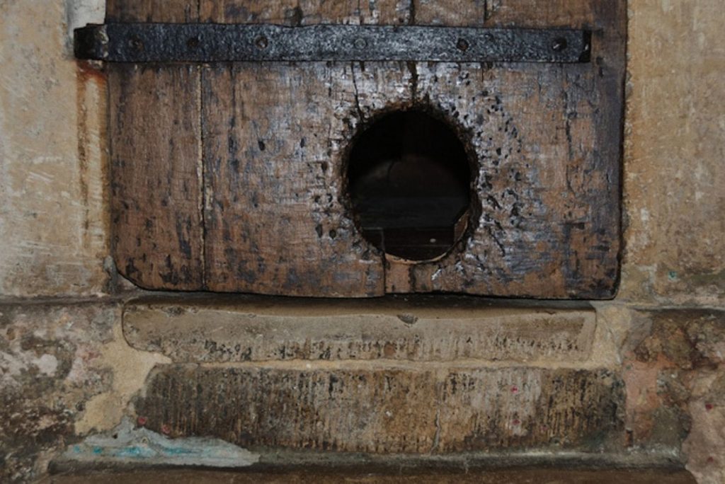 the oldest cat door with a hole