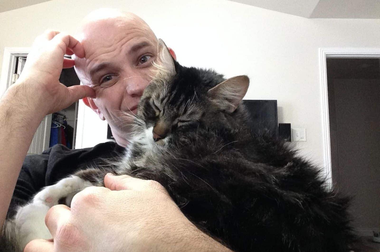 bald guy and cat