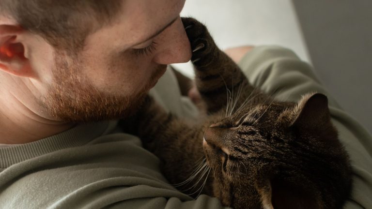 guy holding a cat