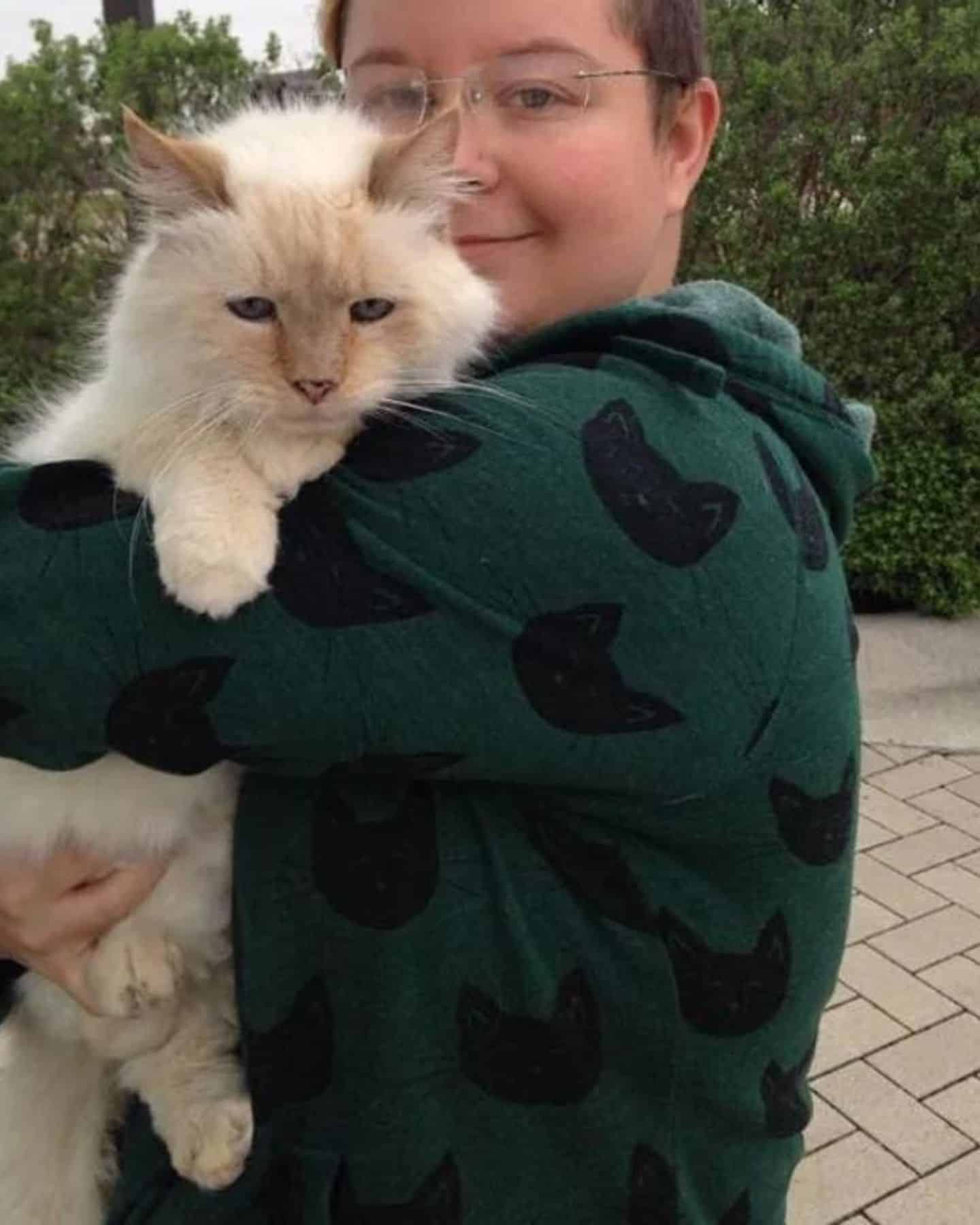 cat in womans arms