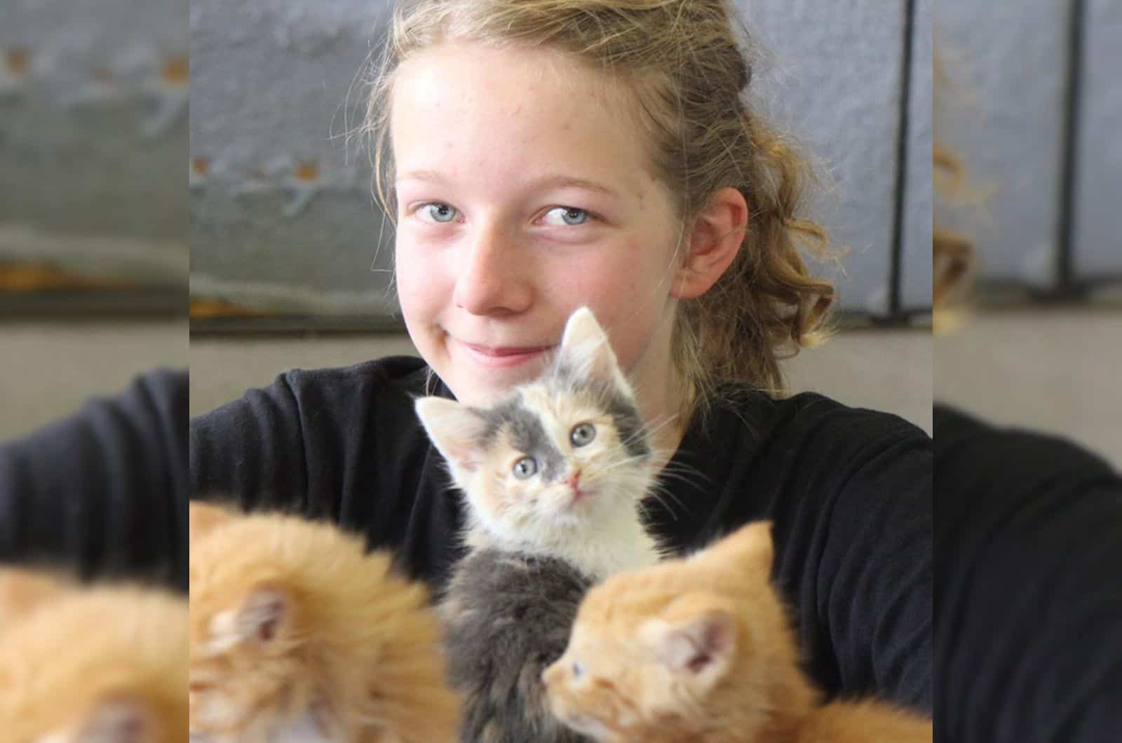 photo of girl with kittens