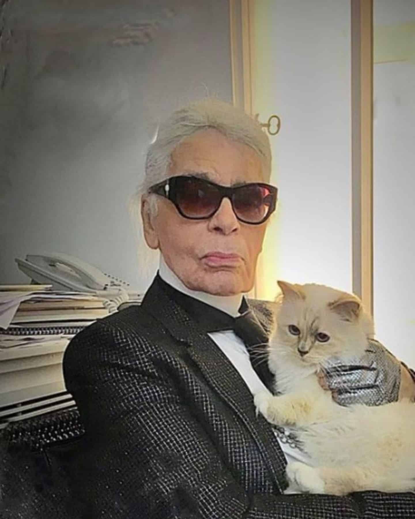 Karl Lagerfeld holding his cat