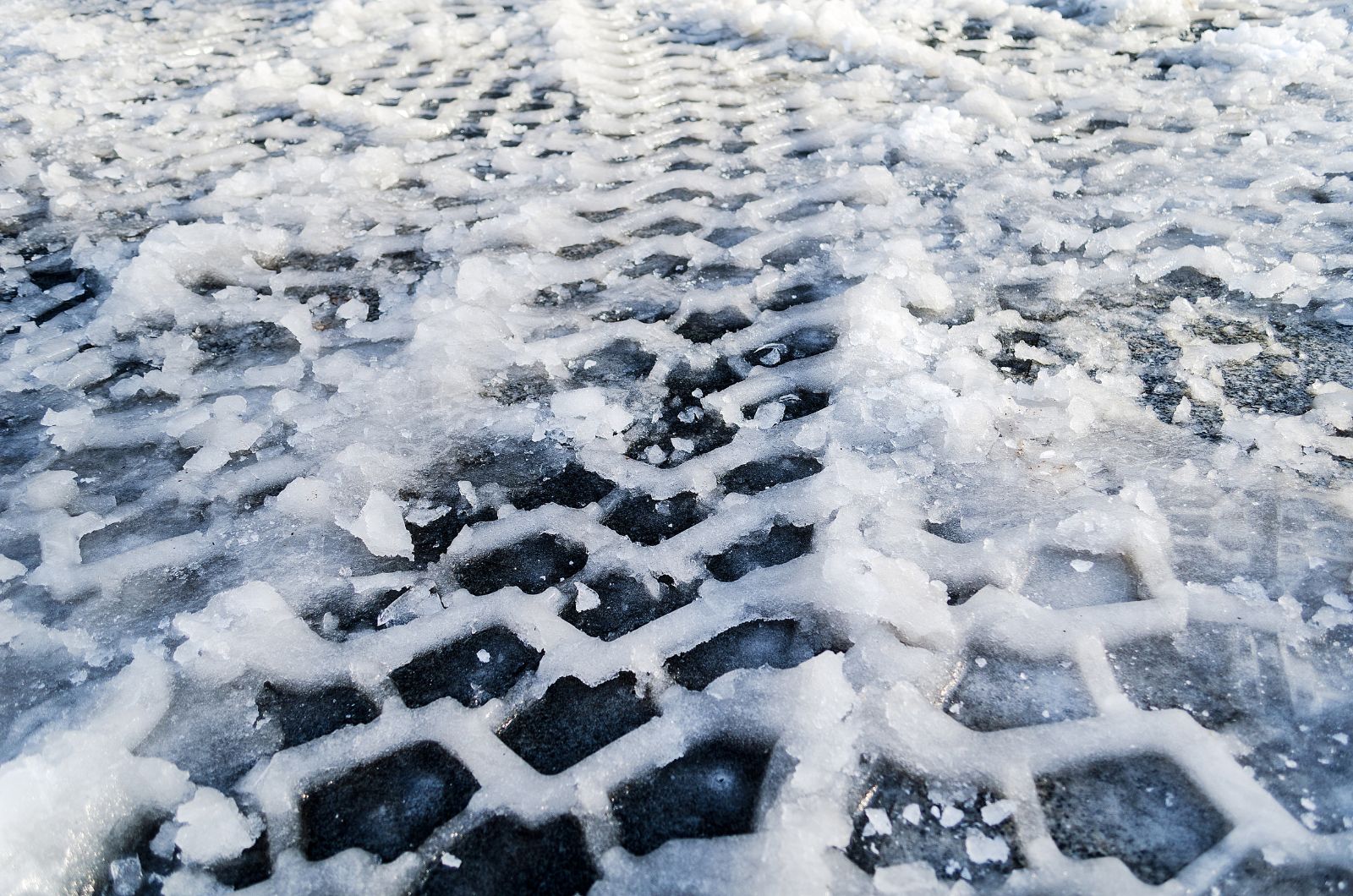close-up photo of ice on the road