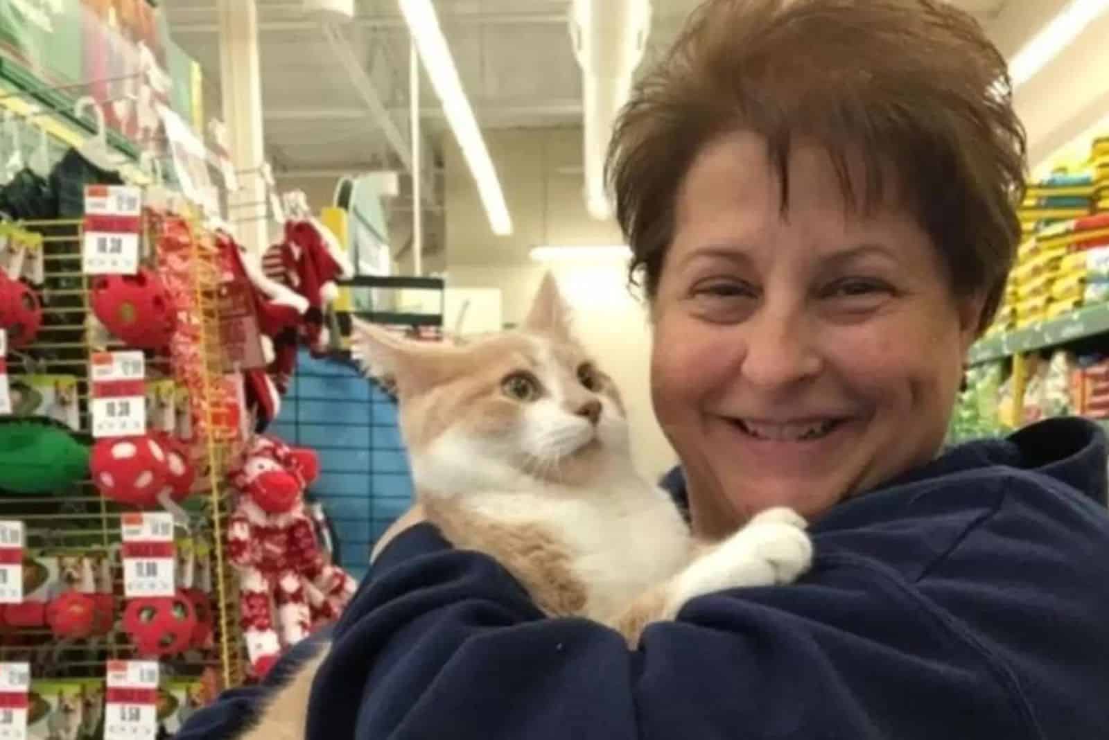happy woman holding a cat