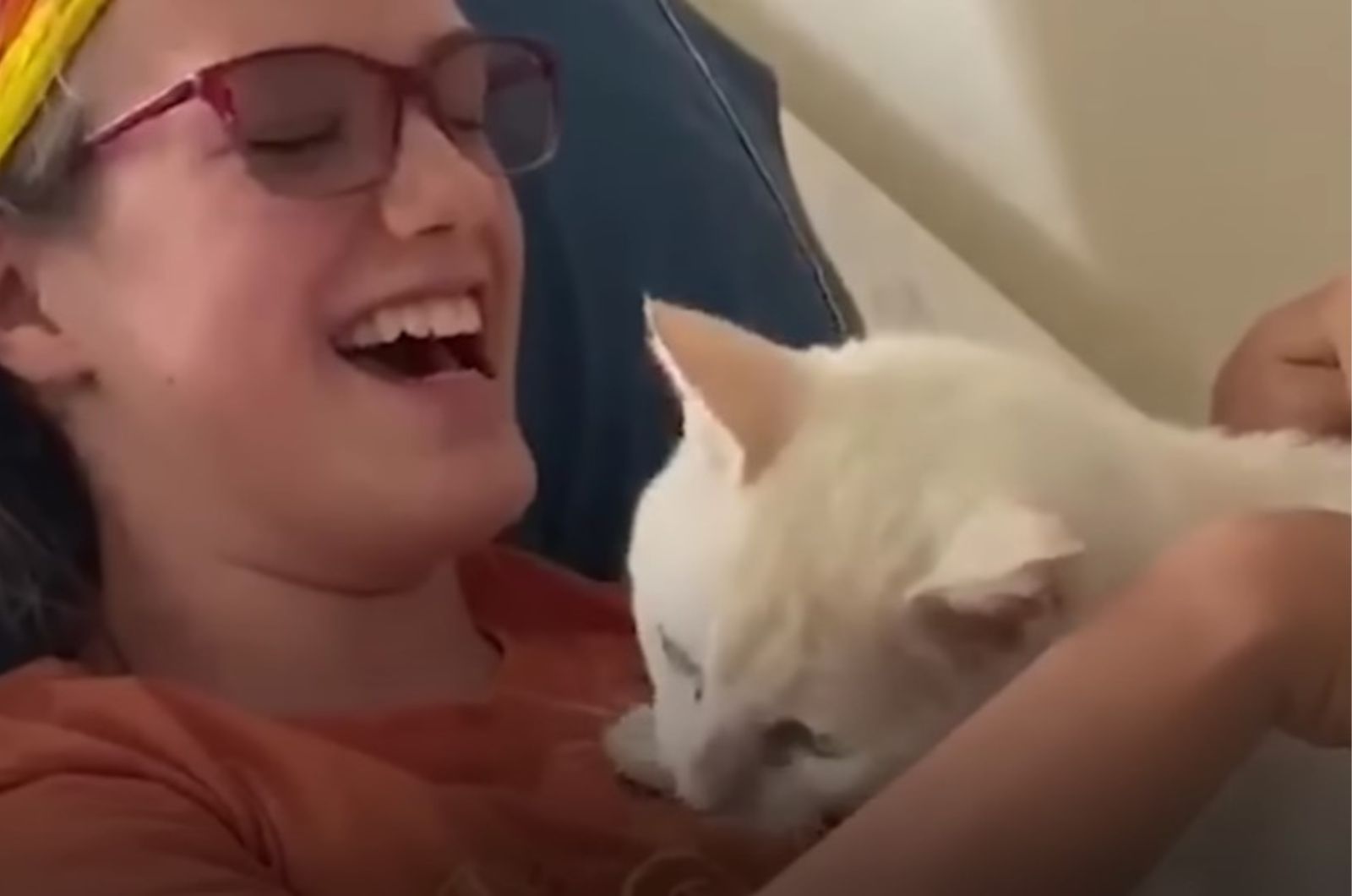 girl-laughing-with-cat