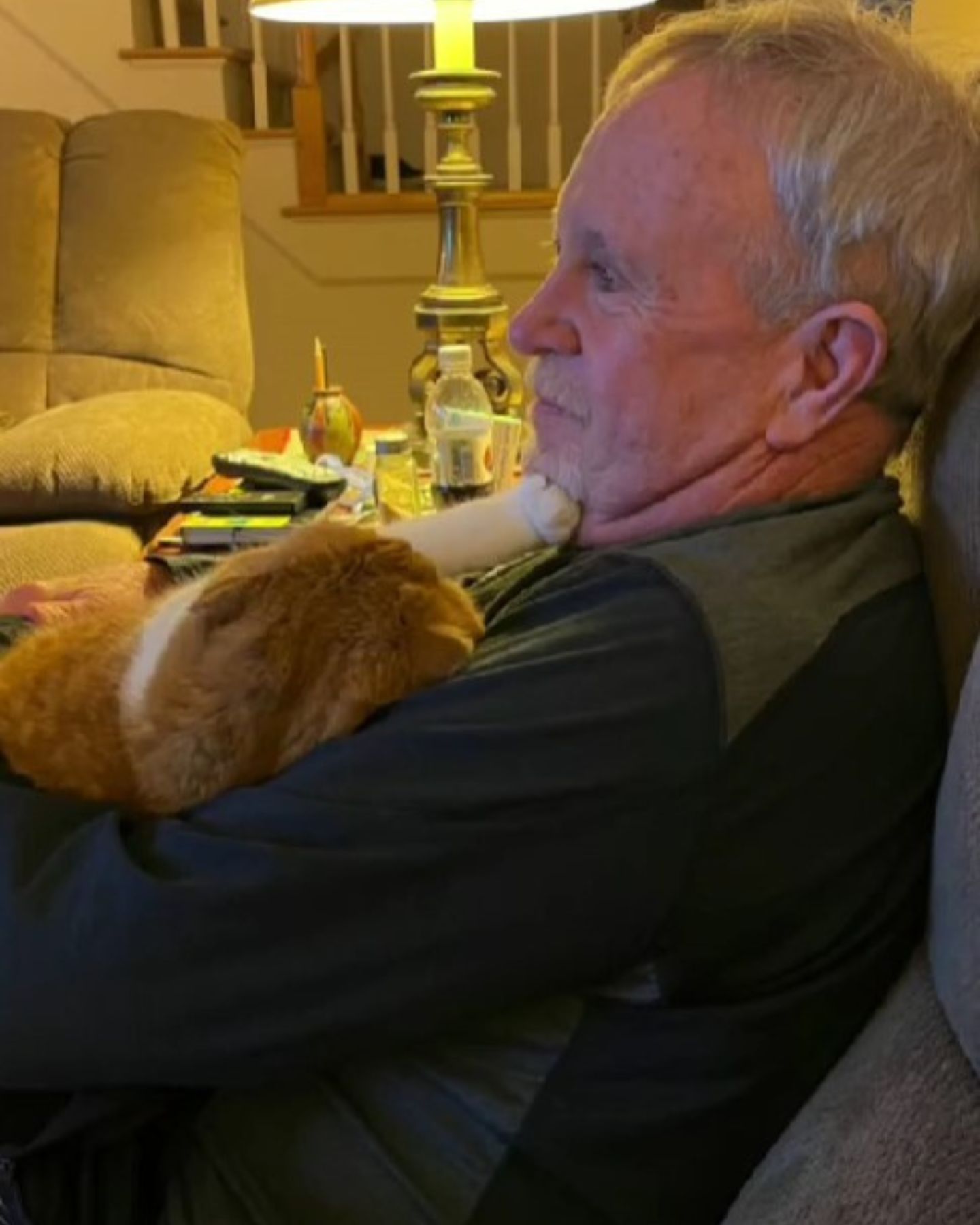 grandpa holding a cat