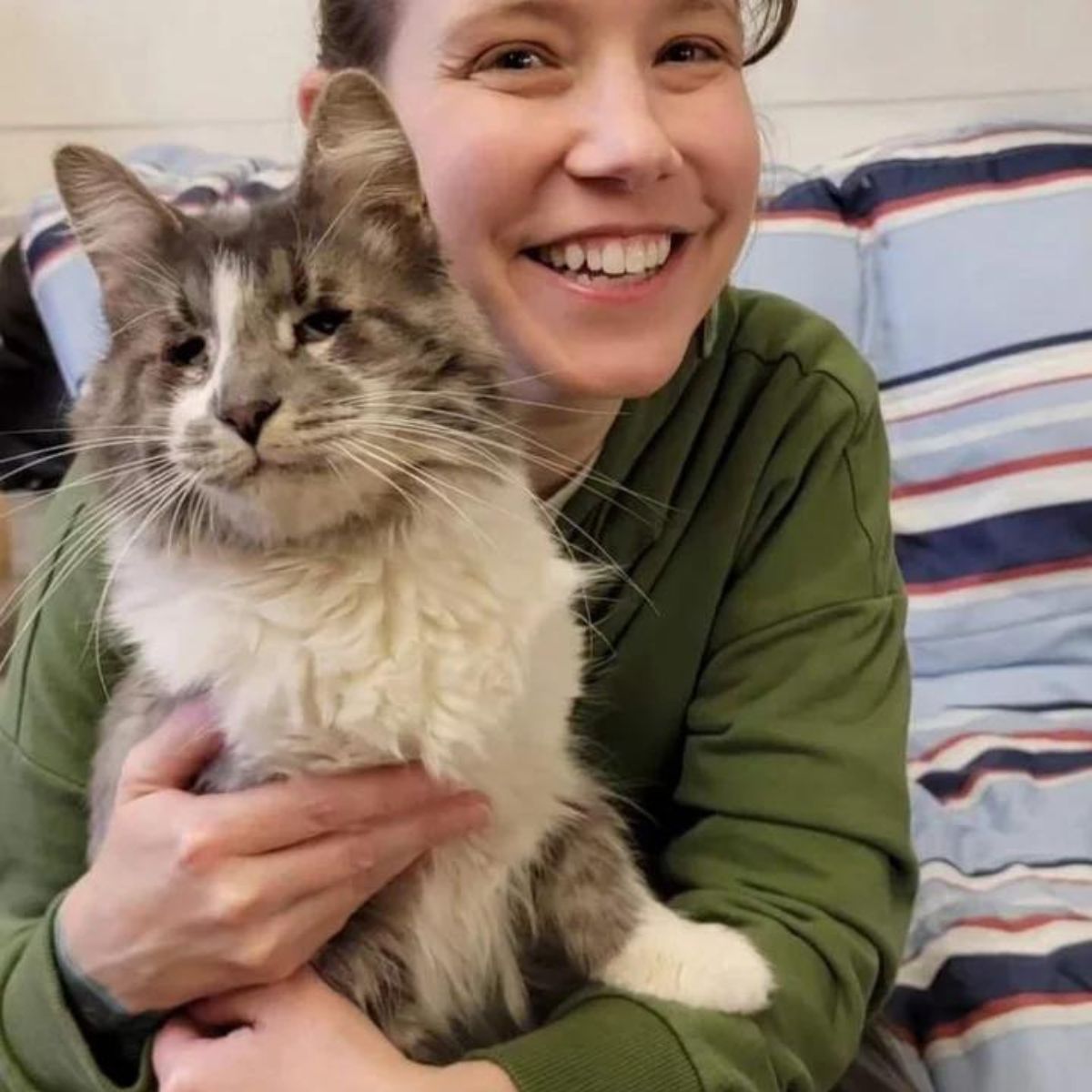 photo of a cat with her adopter