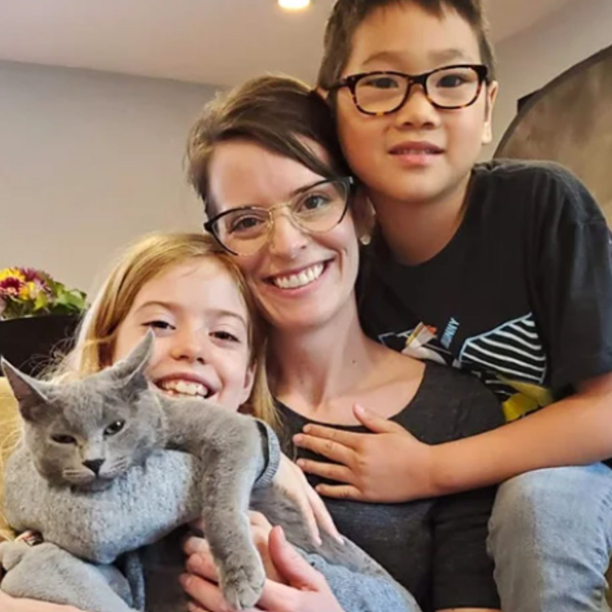 photo of a family with a cat
