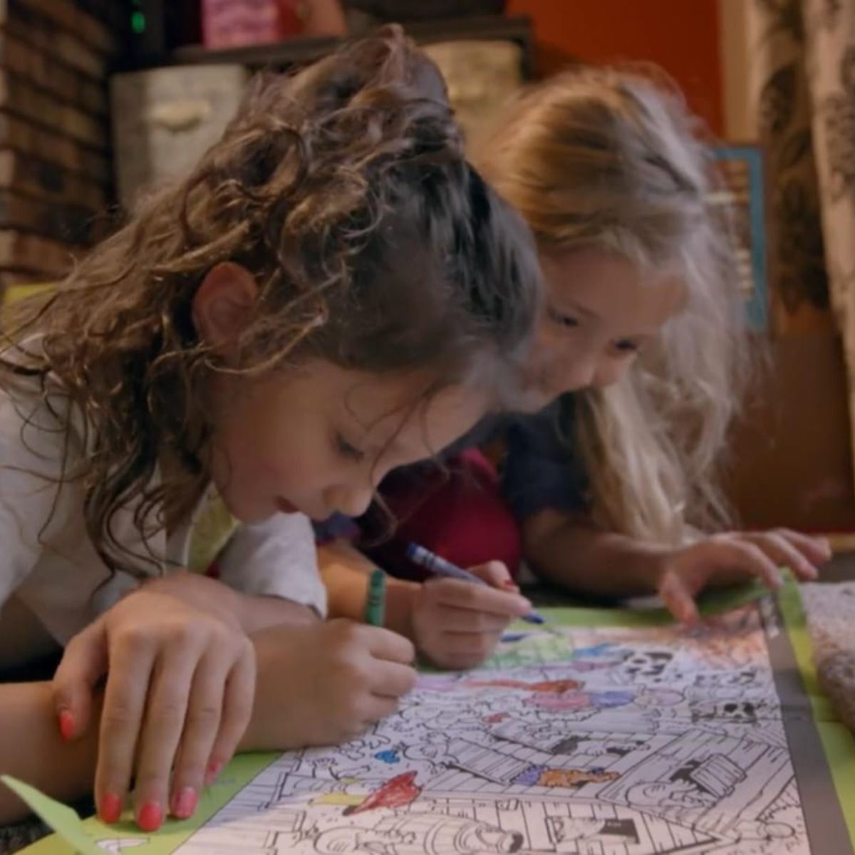 two girls coloring