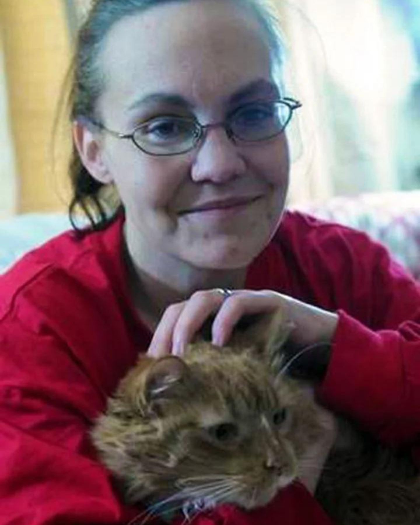 woman with glasses and cat