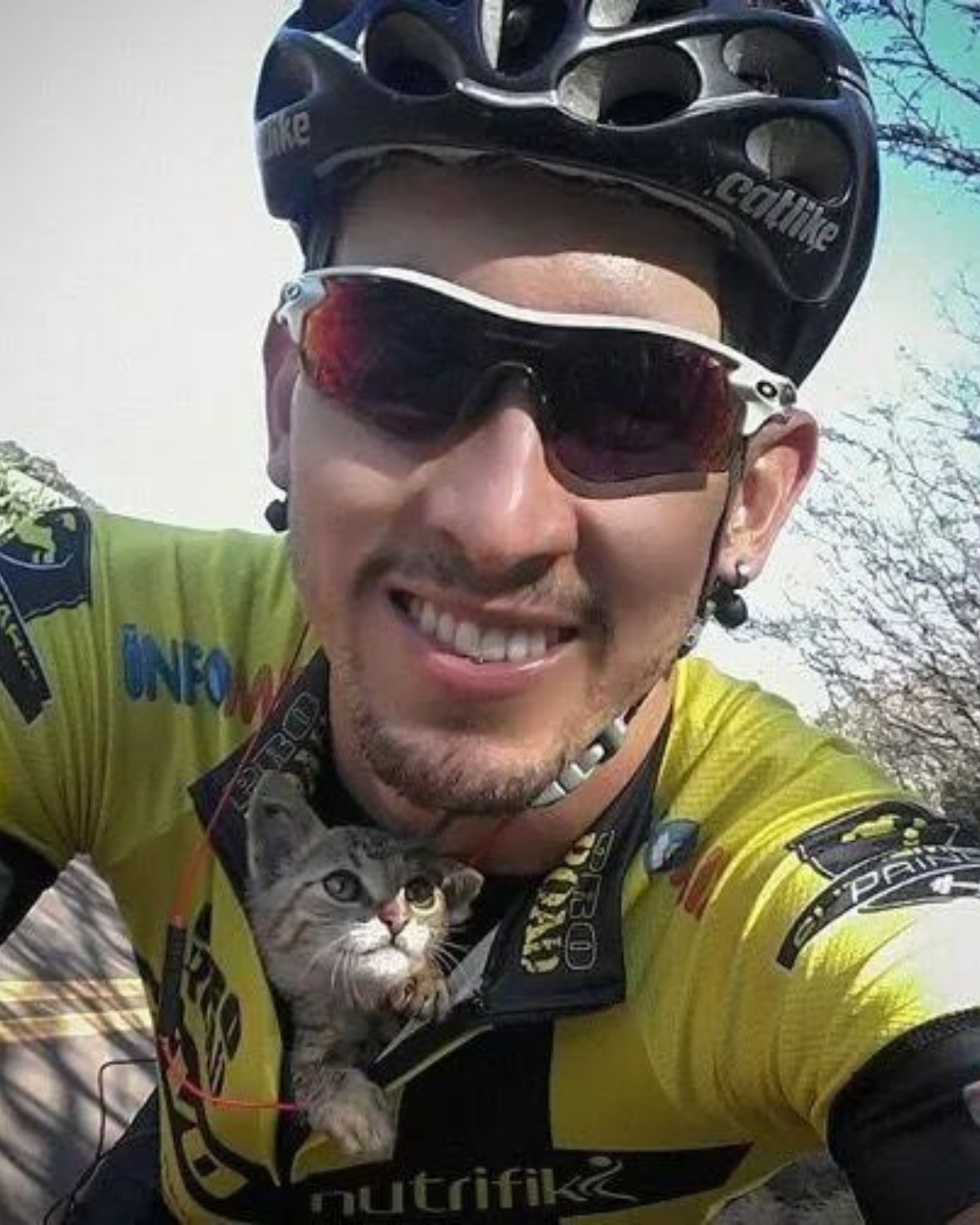 Cyclist with kitten in his tshirt