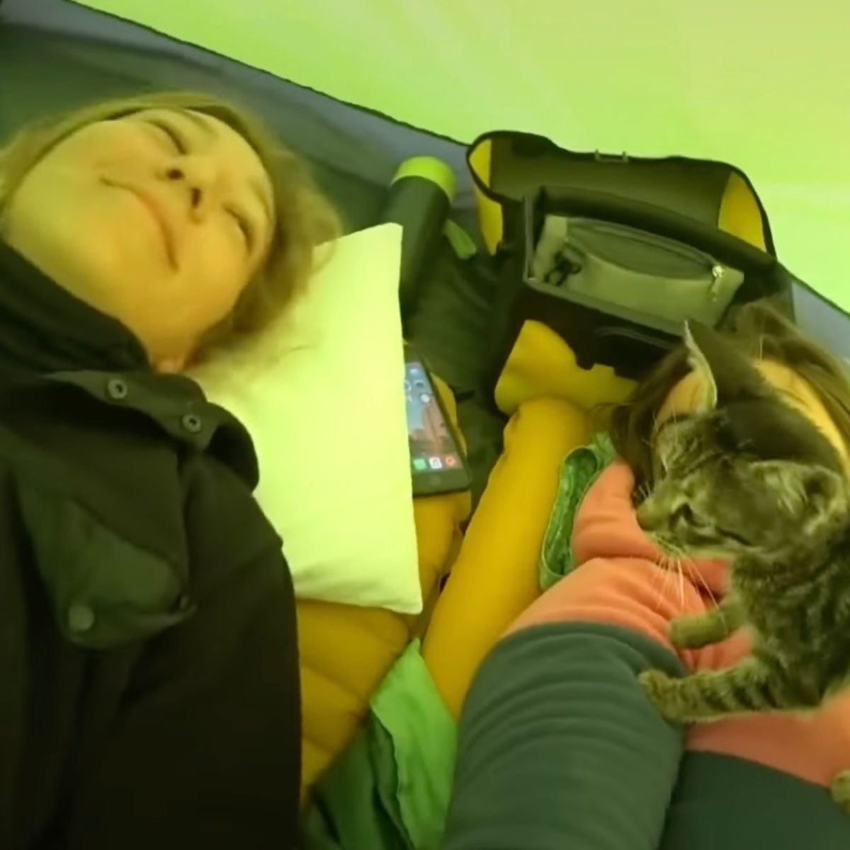 two women and kitten in a tent