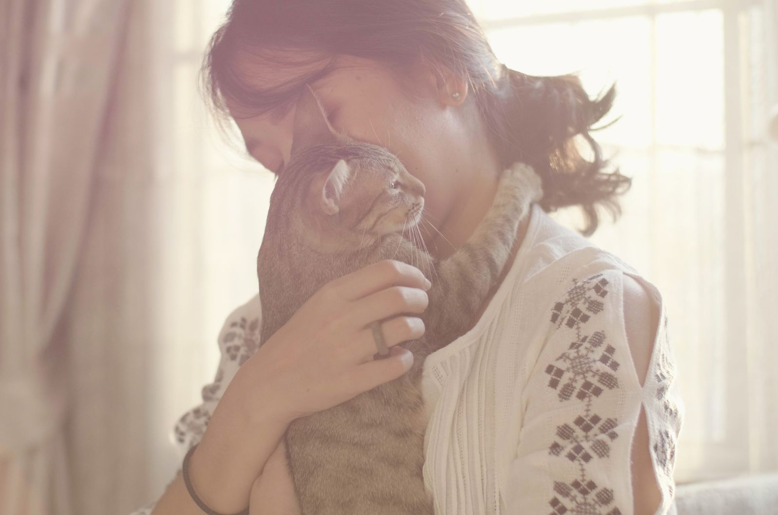 woman holding a cat