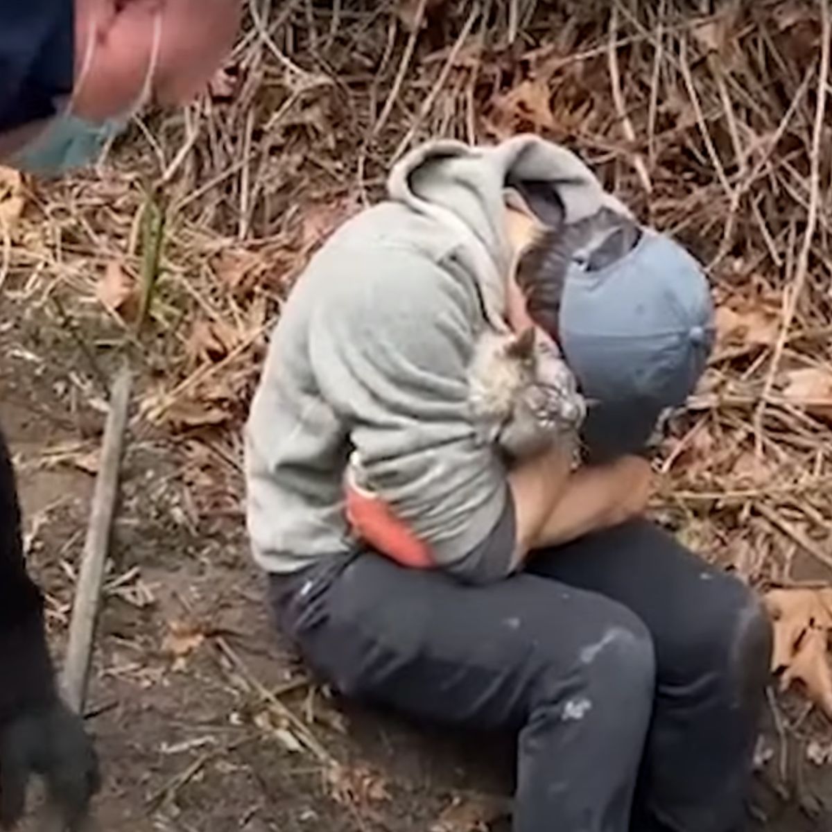 man hugging the rescued cat