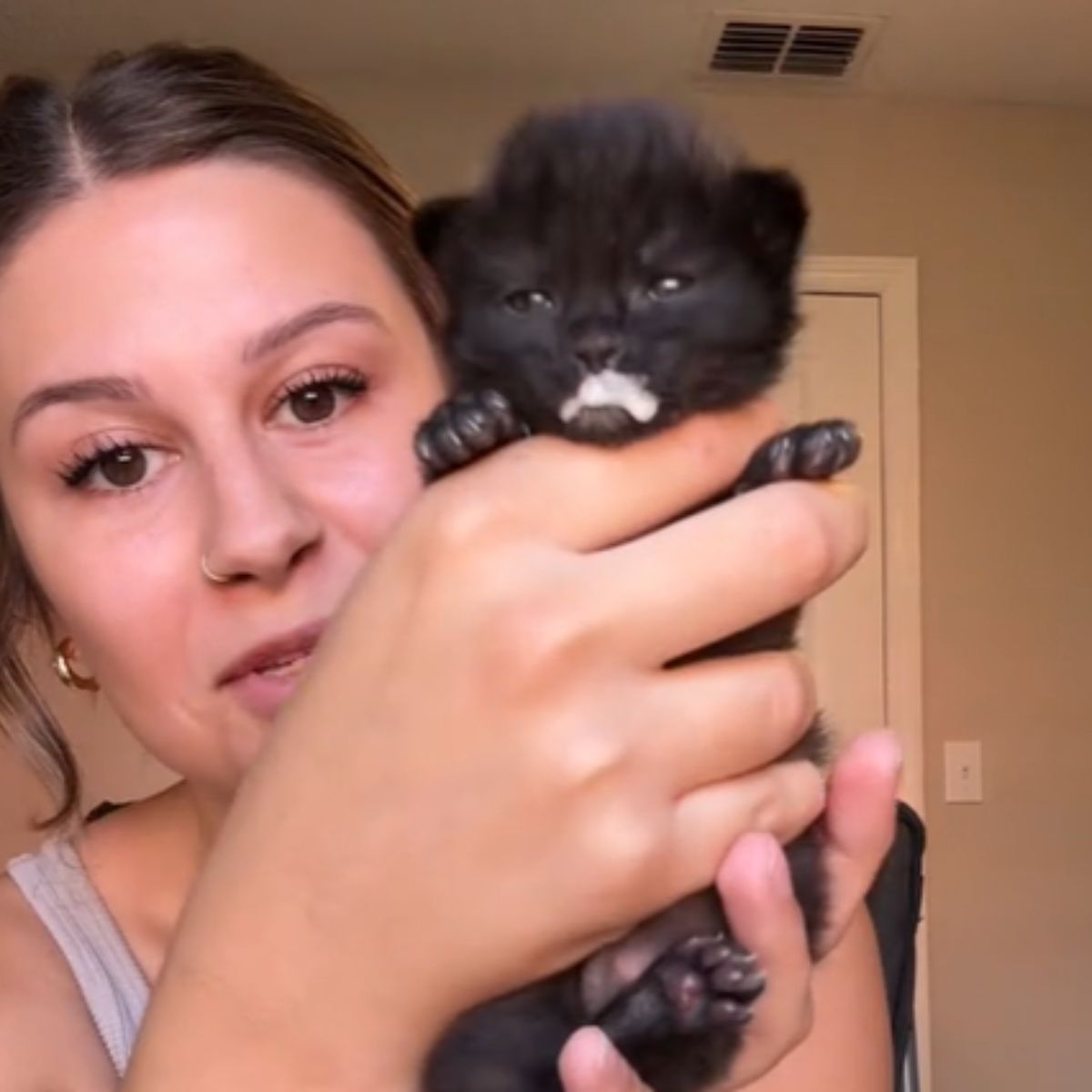 woman holding a kitten