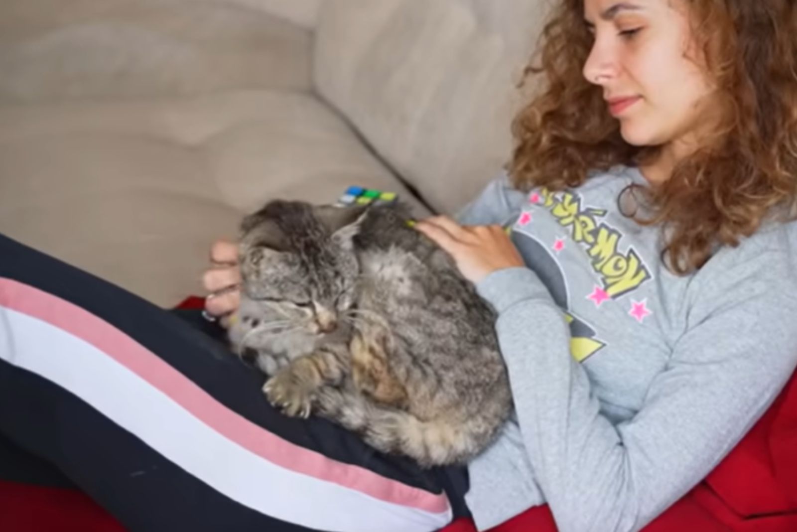 woman holding cat in her lap