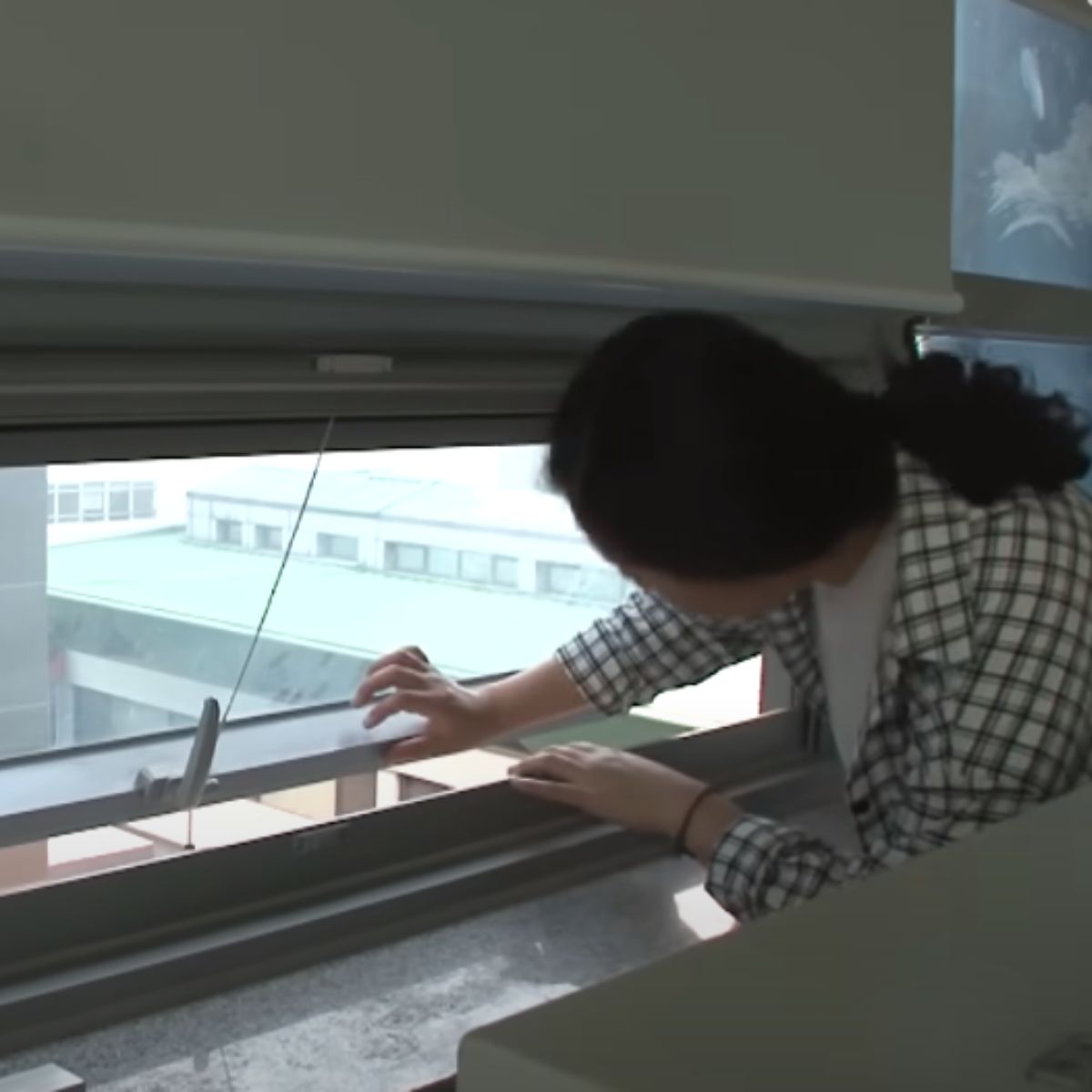 woman opening the window
