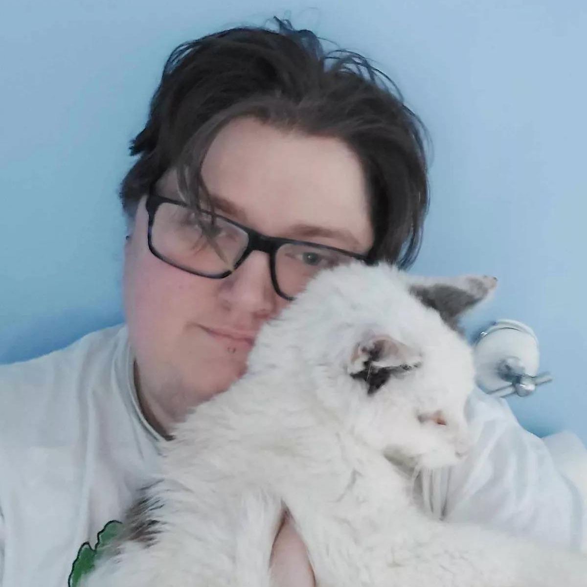 a man holds his cat